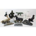 A group of fourteen Inuit hardstone carvings comprising; whale, deer, husky's and various birds (14)