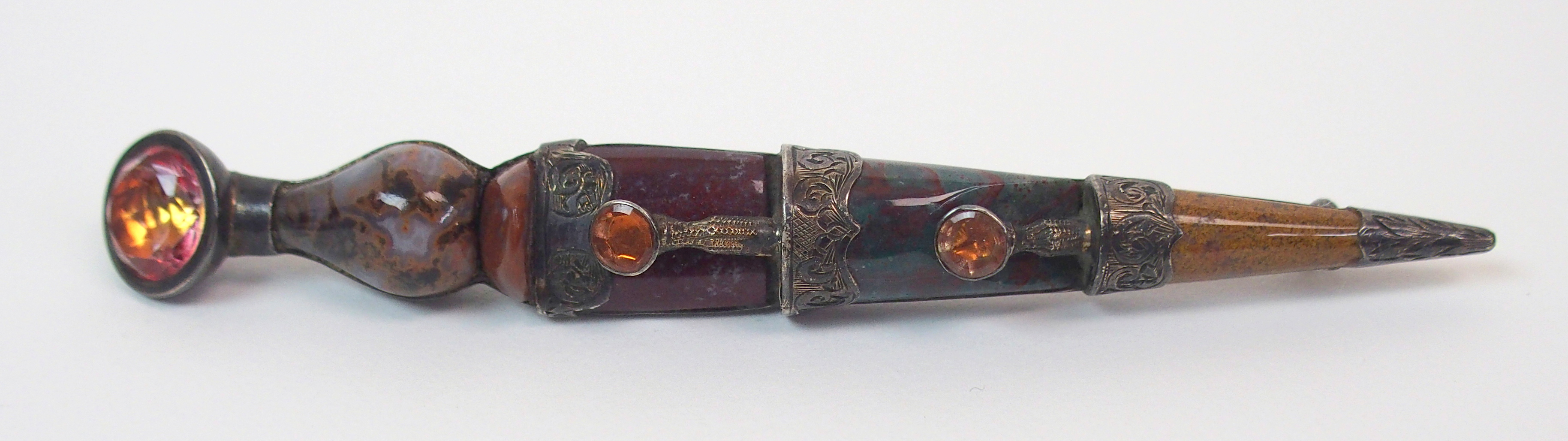 A Victorian Scottish agate kilt pin modelled as a dirk, with a white metal clan badge 'Iste Patriam, - Image 2 of 8