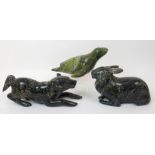 An Inuit hardstone carving of a recumbent hare 14cm high x 22cm wide, a carving of a dog, 12cm