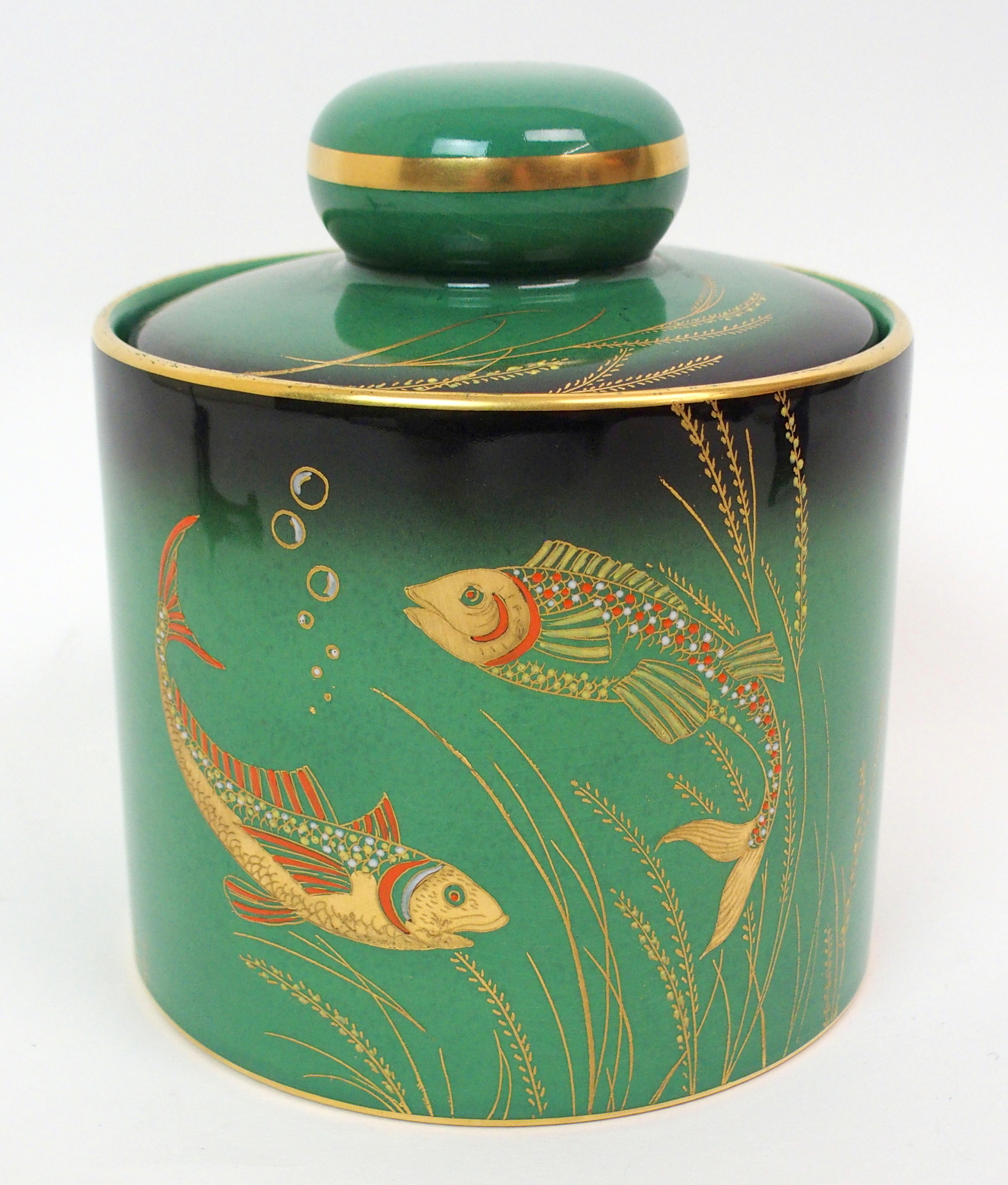 A Carlton Ware for Dunhill 1930s tobacco jar decorated in the River Fish pattern, each side