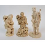 A Japanese ivory okimono with a man carrying a stork tied to his back, signed, (repaired), 13cm