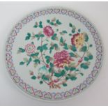 A Cantonese famille rose charger painted with peonies within a ruji head border, red seal mark, 37.