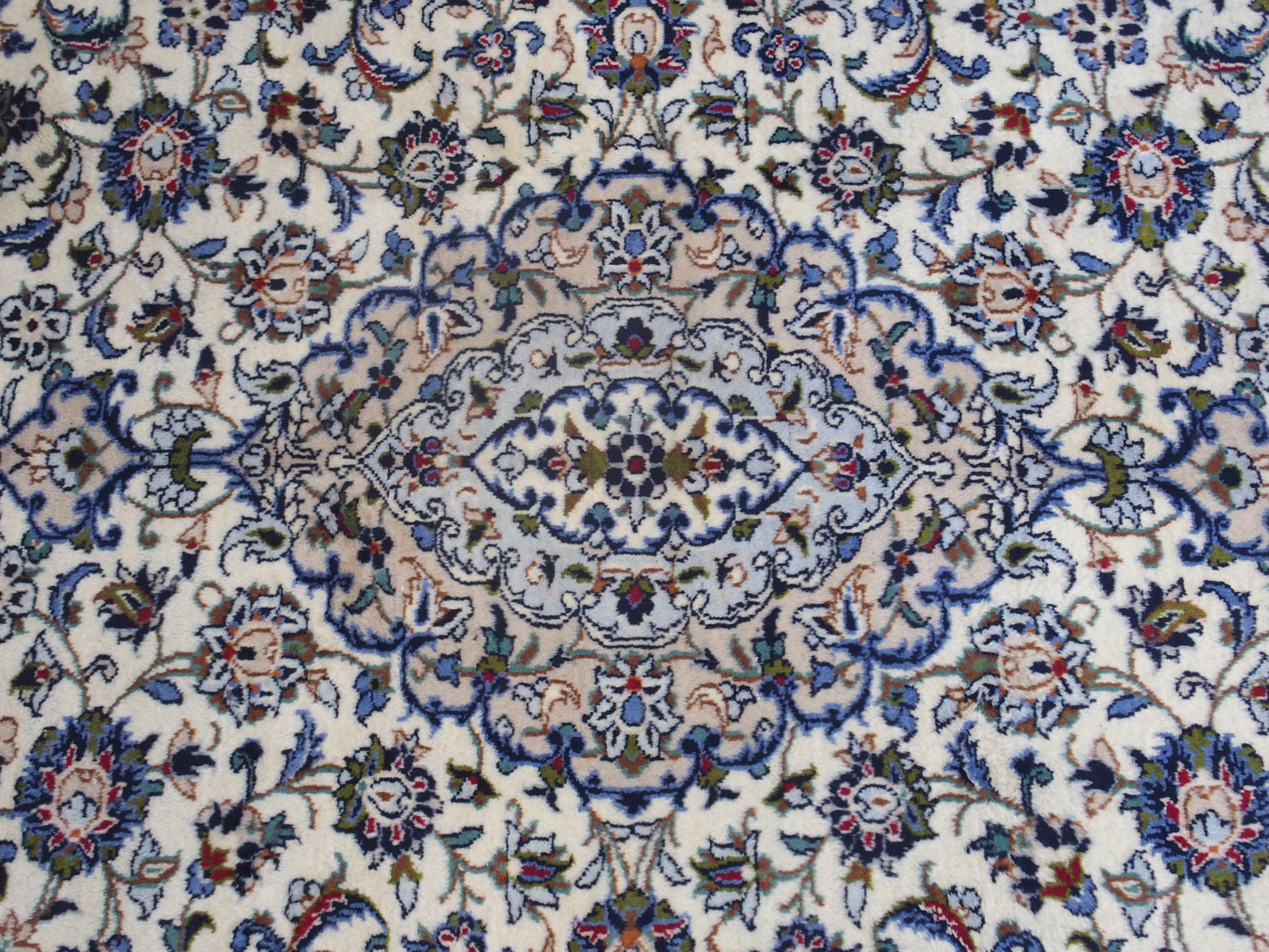 A CREAM GROUND KASHAN RUG with floral designs, central medallion and a border with floral palmettes, - Image 2 of 4