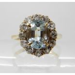 AN AQUAMARINE AND DIAMOND CLUSTER RING the surrounding old cut diamonds are estimated