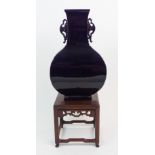 A CHINESE MONOCHROME SQUARE BALUSTER SHAPED VASE with pierced handles, 20th Century, 28cm high and a