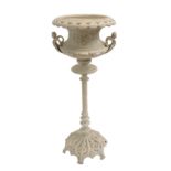 A CAST METAL JARDINIERE with caryatid handles above a spiral column and on a pierced stylised