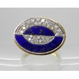 AN 18CT GOLD STYLISH LAPIS LAZULI AND DIAMOND RING in an Art Deco style, finger size L, head size