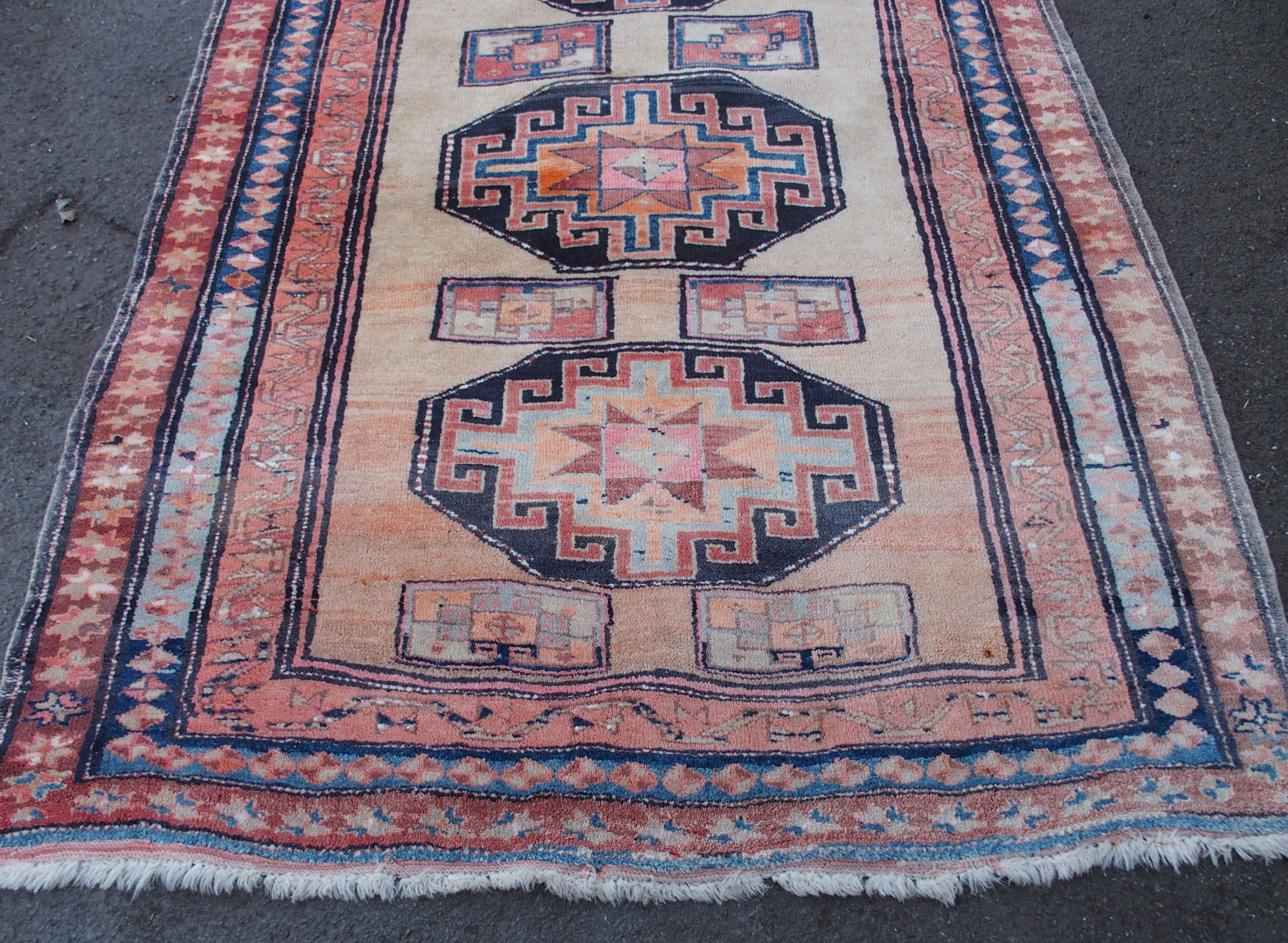 AN ARAAK RED GROUND RUG with multiple borders, 320cm x 150cm and an Eastern rug with four central - Image 8 of 10