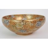 A SATSUMA BOWL painted allover with dense flowers in various enamel colours, gilt dentil foot rim,