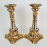 A PAIR OF ROYAL CROWN DERBY CANDLESTICKS pattern no 1128, circa 1974, 26.5cm high (2) Condition