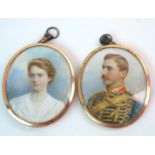 A PAIR OF PAINTED PORTRAIT MINIATURES OF AN ARMY OFFICER AND HIS WIFE indistinctly signed Hall,