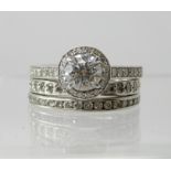 A TRIO OF TIFFANY PLATINUM DIAMOND RINGS a diamond ring from their Halo collection, set with