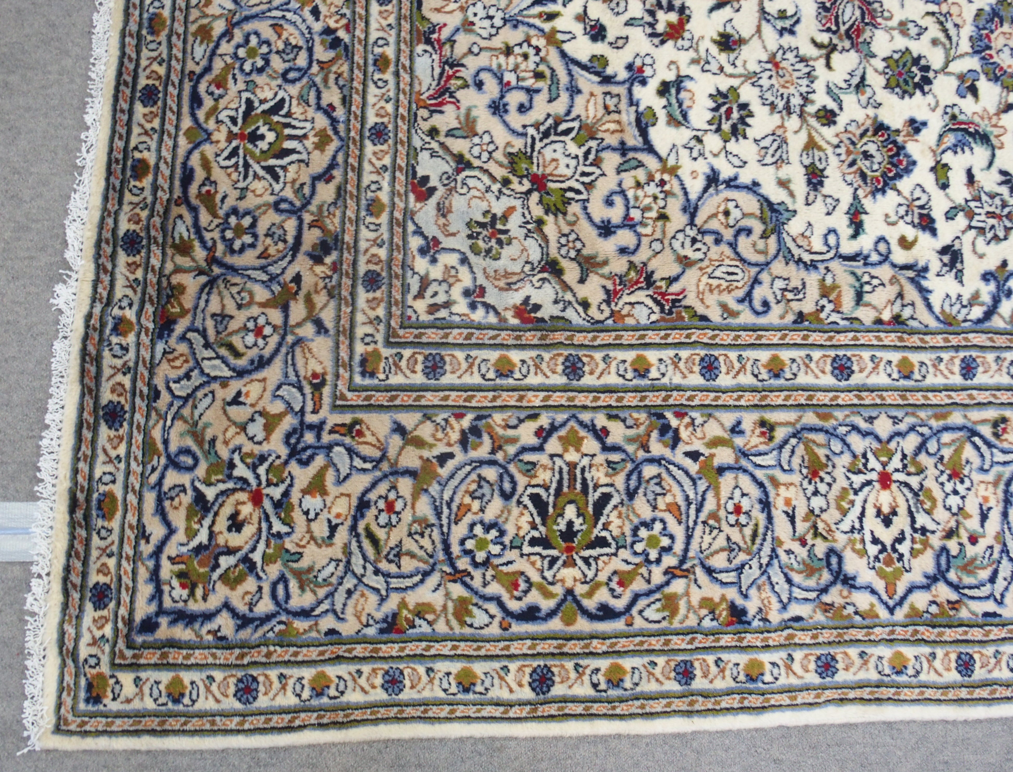 A CREAM GROUND KASHAN RUG with floral designs, central medallion and a border with floral palmettes, - Image 3 of 4