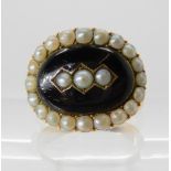 A BLACK ENAMEL AND PEARL MOURNING RING in yellow metal the inscription reads 'Will Turner gent. died