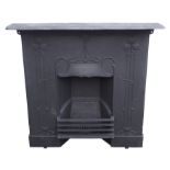 AN ARTS AND CRAFTS CAST IRON FIRE SURROUND with stylised foliage with shelf and grill, 100cm high