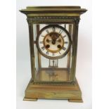 A FRENCH GLASS AND BRASS MANTEL CLOCK the white enamelled dial with roman numerals, the movement