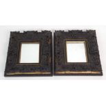 A PAIR OF CARVED HARDWOOD FRAMES of rectangular form and carved with shields and swags, each with