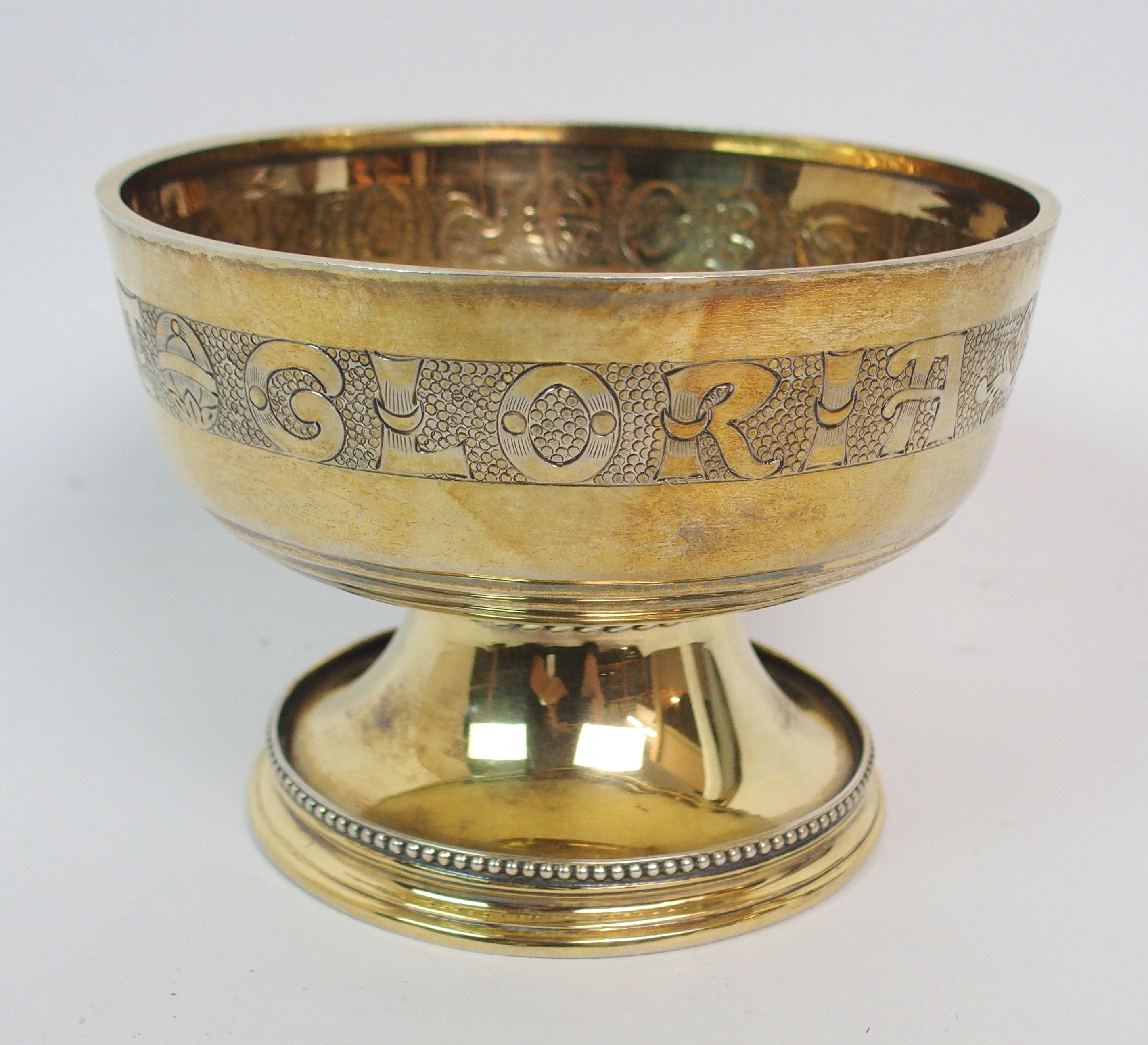 A SILVER GILT CHALICE by Hamilton and Inches, Edinburgh 1930, of circular form with "Sol Deo Honor