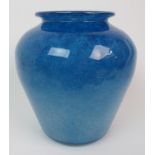 A MONART GLASS VASE the mottled blue baluster body tapering down, with a lip to the rim, shape