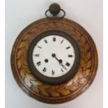 A 19TH CENTURY FRENCH TOLEWARE CLOCK painted with a gilt wreath of leaves and berries on a red