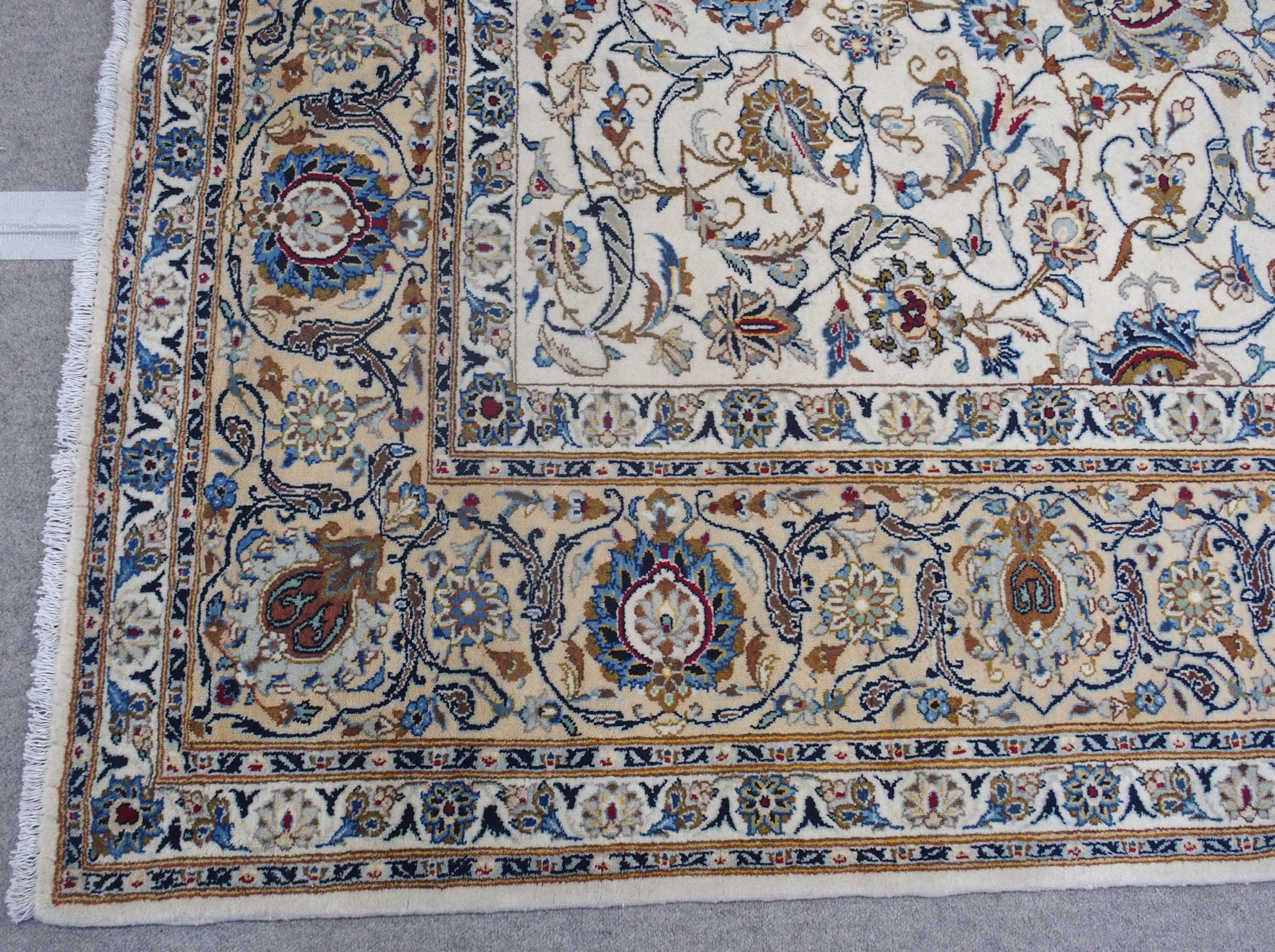 A CREAM GROUND FINE KASHAN RUG with allover floral design and floral palmette border, 353cm x - Image 4 of 5