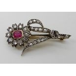 A RUBY AND DIAMOND FLOWER BROOCH set with rose cut diamonds, mounted in yellow and white metal,