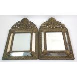 FOUR VICTORIAN ROCOCO STYLE BRASS WALL MIRRORS with bevelled edge central mirror and sloping side