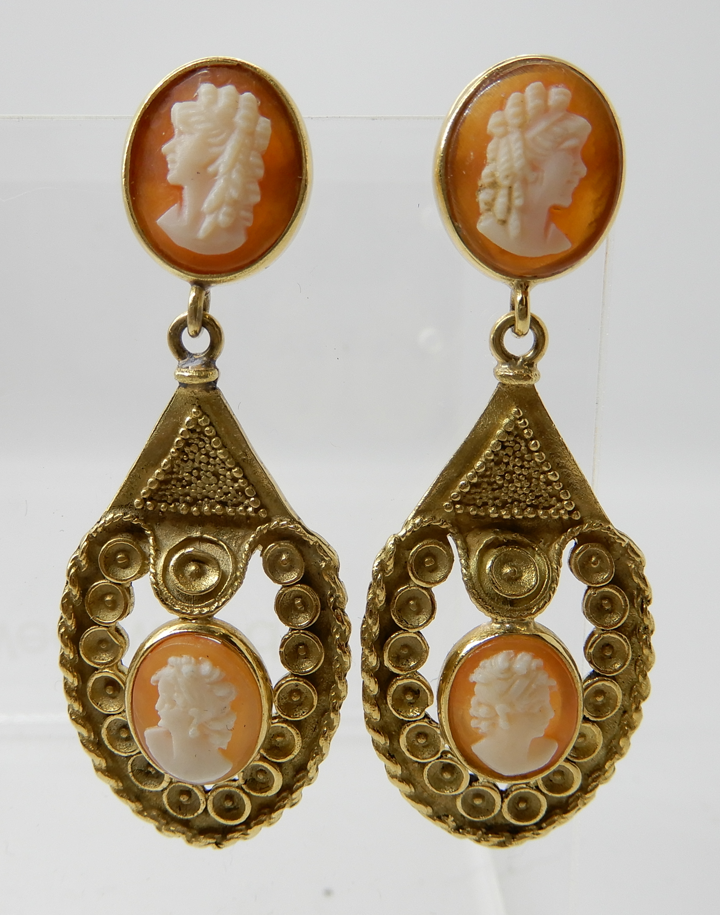 A PAIR OF 18CT GOLD CAMEO EARRINGS with decorative mounts, post and butterfly fitting. Stamped 750