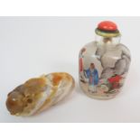 A CHINESE INSIDE PAINTED SNUFF BOTTLE painted with figures meeting before a river, signed, 8.5cm