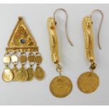 A PAIR OF NUBIAN GOLD EARRINGS WITH COIN DETAIL length 7cm, with Arabic hallmarks, together with a