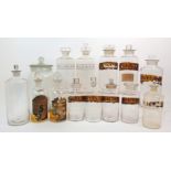 A COLLECTION OF GLASS CHEMISTS BOTTLES including ten with painted gilt and black labels, two with