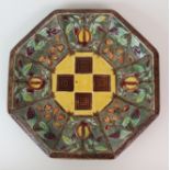 A THOMAS FORESTER OCTAGONAL MAJOLICA PLATE decorated with a brown and yellow checkerboard effect