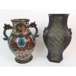 A CHINESE CLOISONNE TWO-HANDLED VASE decorated with medallions of dragons, still leaf lappets and