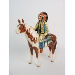 A BESWICK MODEL OF AN AMERICAN INDIAN sat upon skewbald horse, 21.3cm high Condition Report: