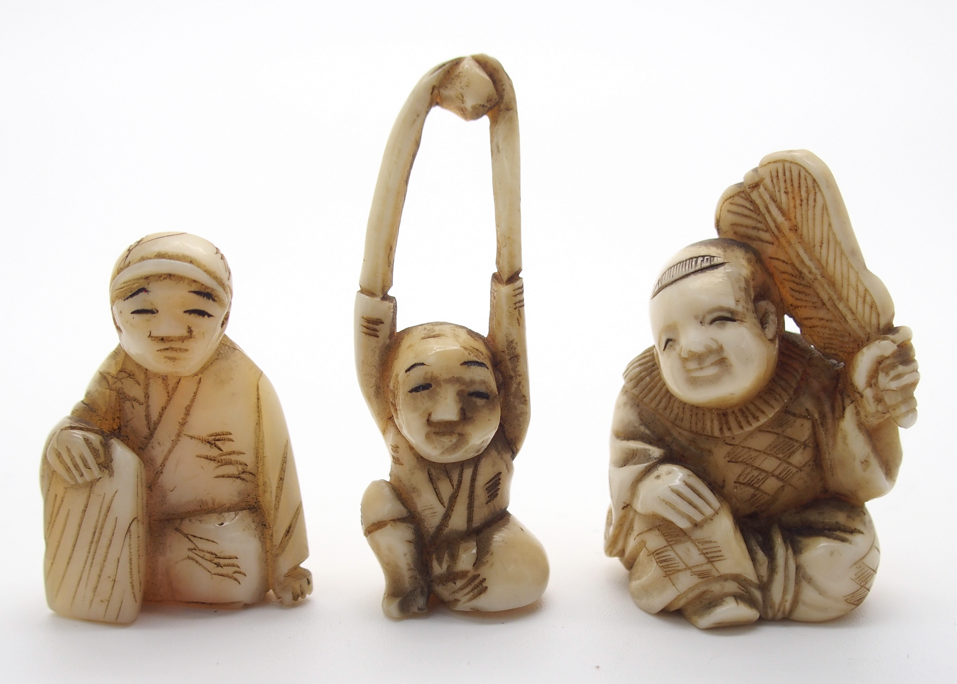 A JAPANESE IVORY OKIMONO ONI holding a temple bell enclosing another demon, 5cm high, a netsuke of a - Image 5 of 10