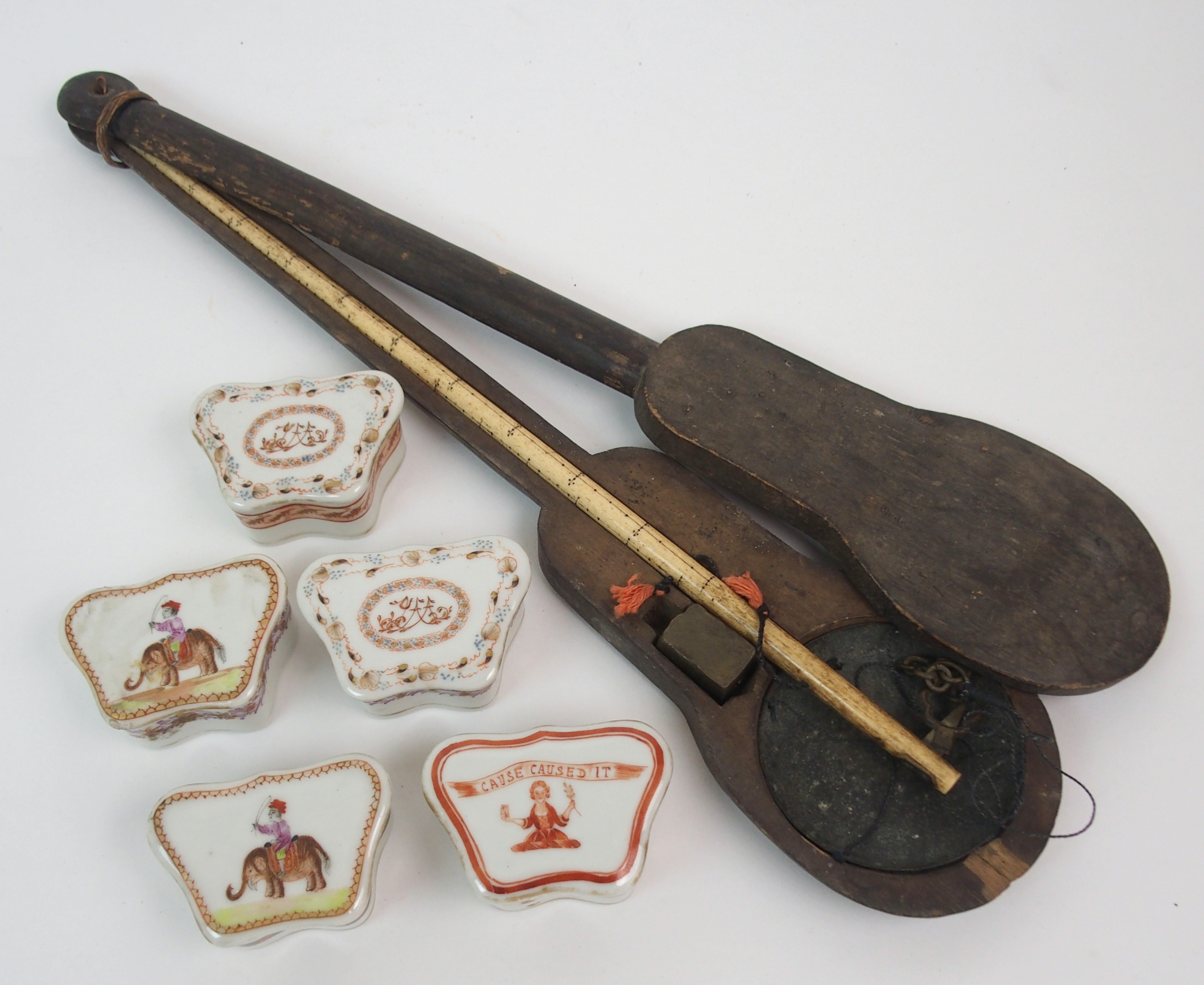 A CHINESE SET OF BONE OPIUM SCALES with metal weight and pans within a boxwood case, 43cm long and