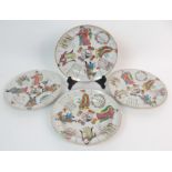 FOUR CANTON PLATES painted with figures, calligraphy, coins and birds within gilt rims (one with rim