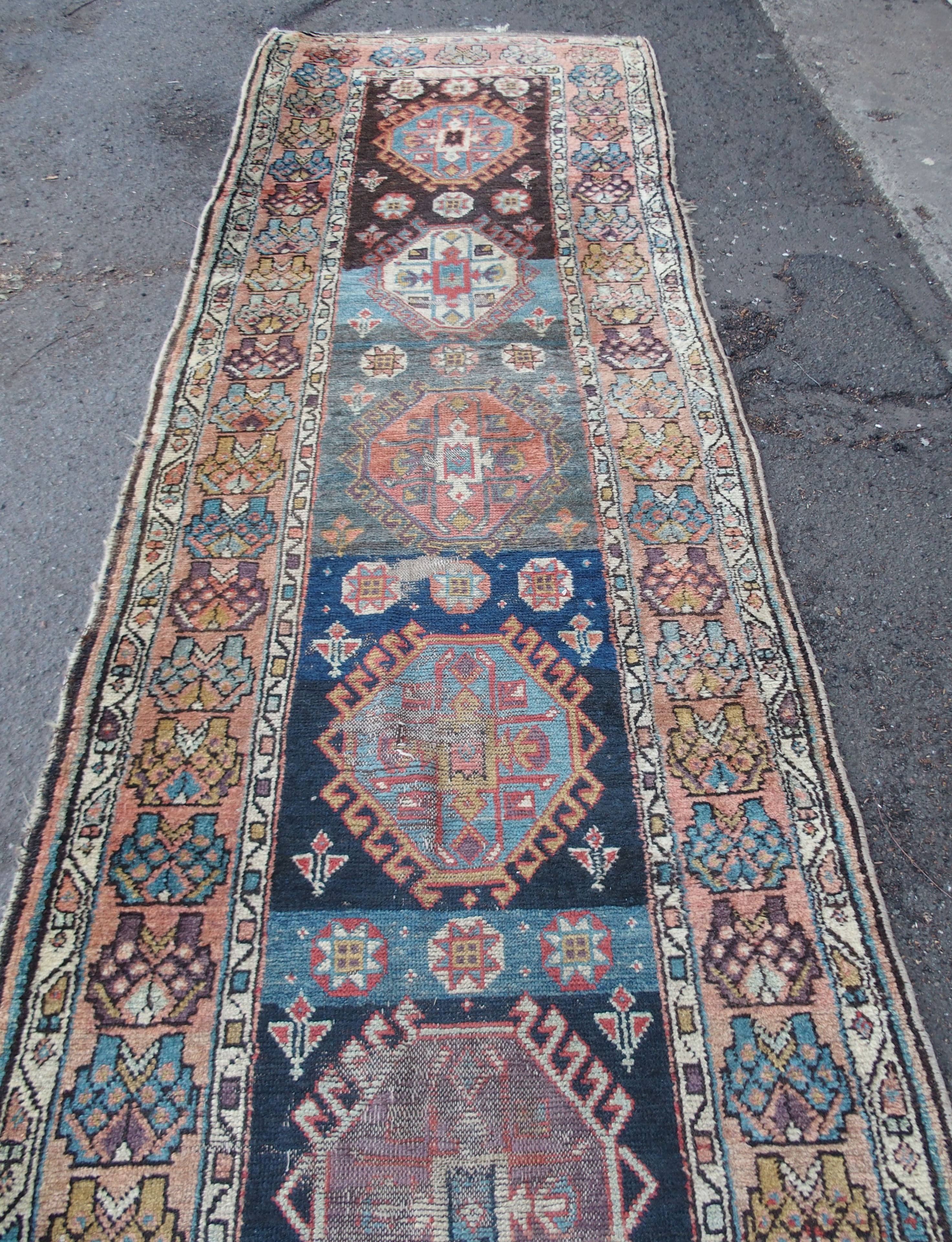 A CAUCASIAN BLUE GROUND RUNNER with nine central medallions and geometric border, 474cm x 96cm and - Image 5 of 10