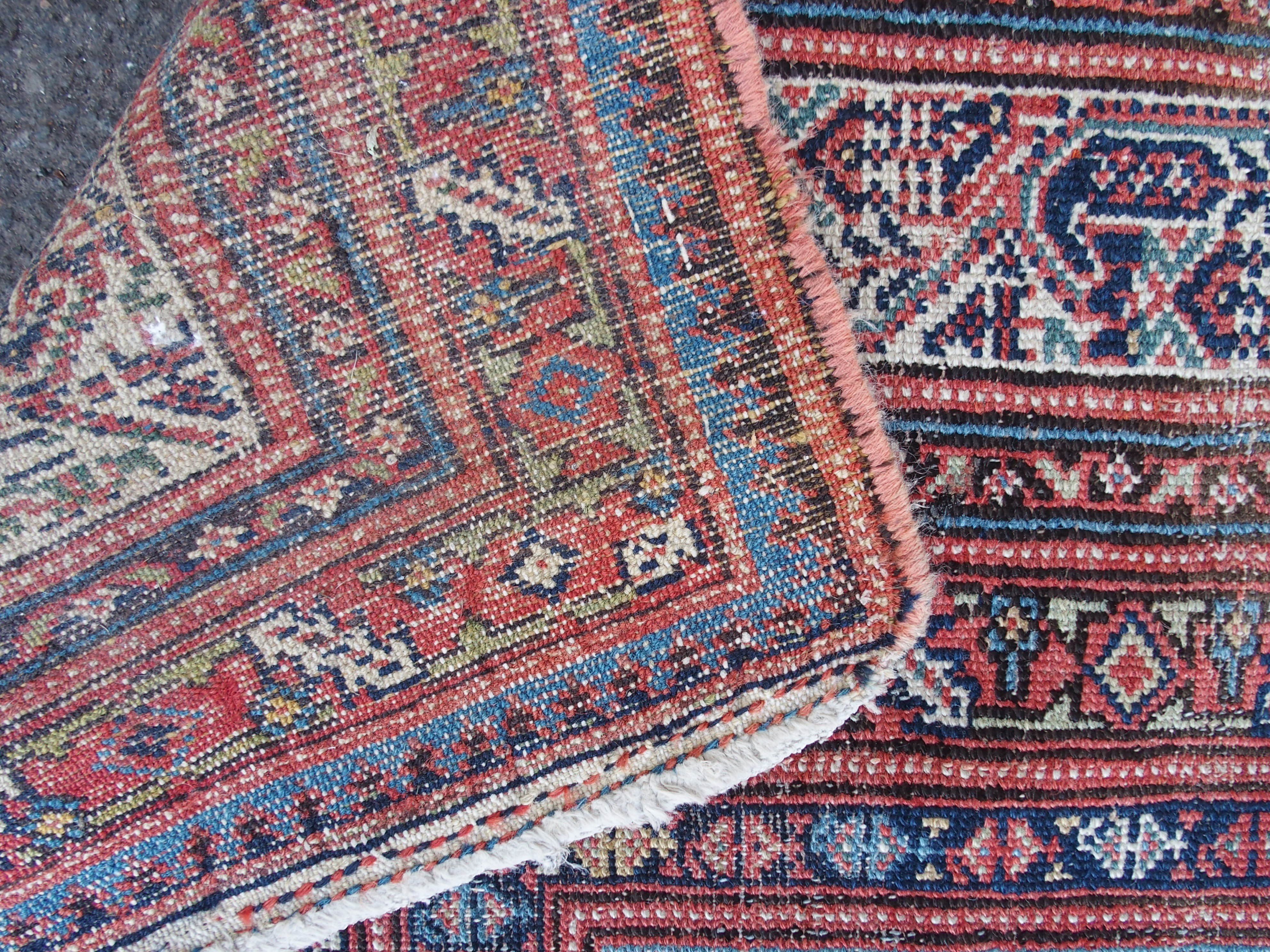 AN ARAAK RED GROUND RUG with multiple borders, 320cm x 150cm and an Eastern rug with four central - Image 6 of 10
