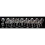 A PART SUITE OF VICTORIAN DRINKING GLASSES each of fluted shape with cut decoration, including