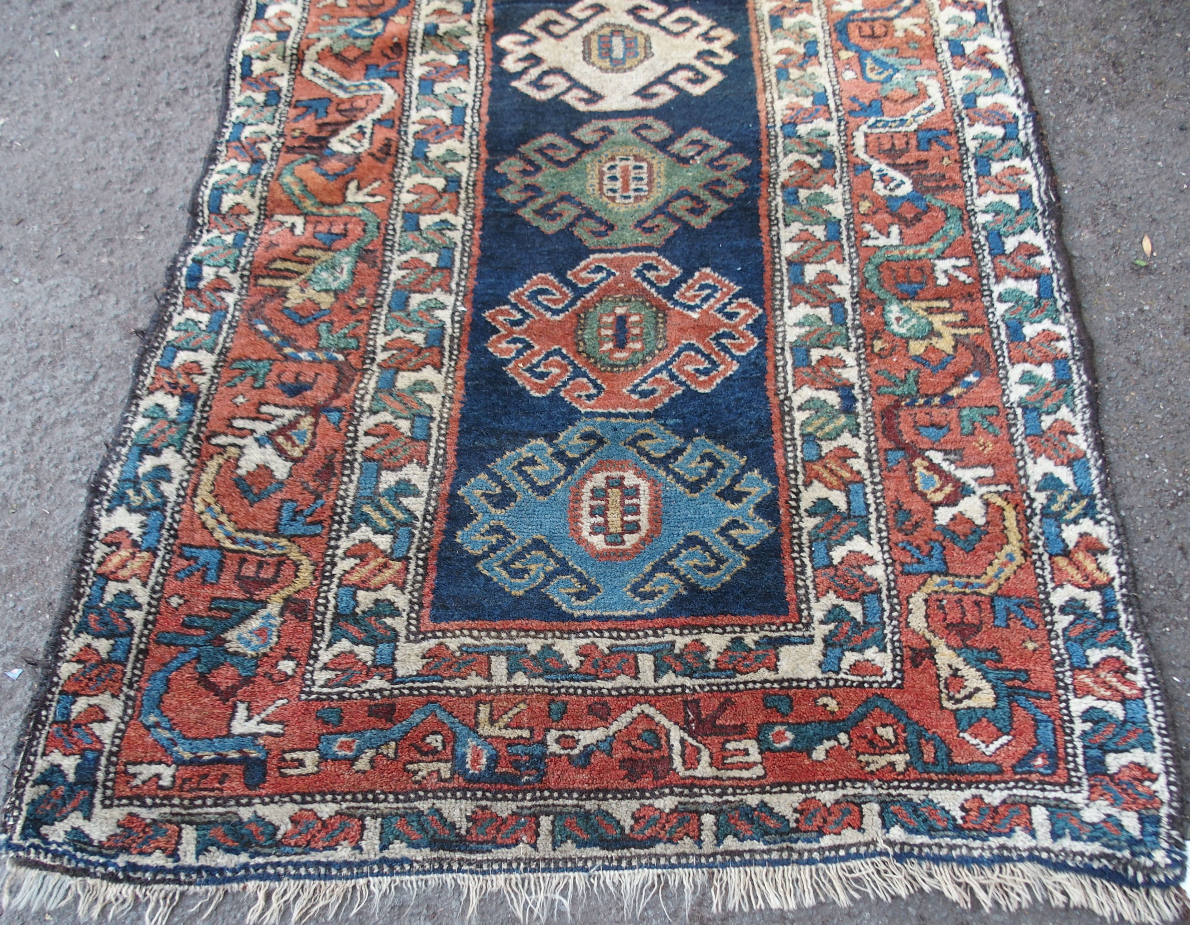 A CAUCASIAN BLUE GROUND RUNNER with nine central medallions and geometric border, 474cm x 96cm and - Image 8 of 10