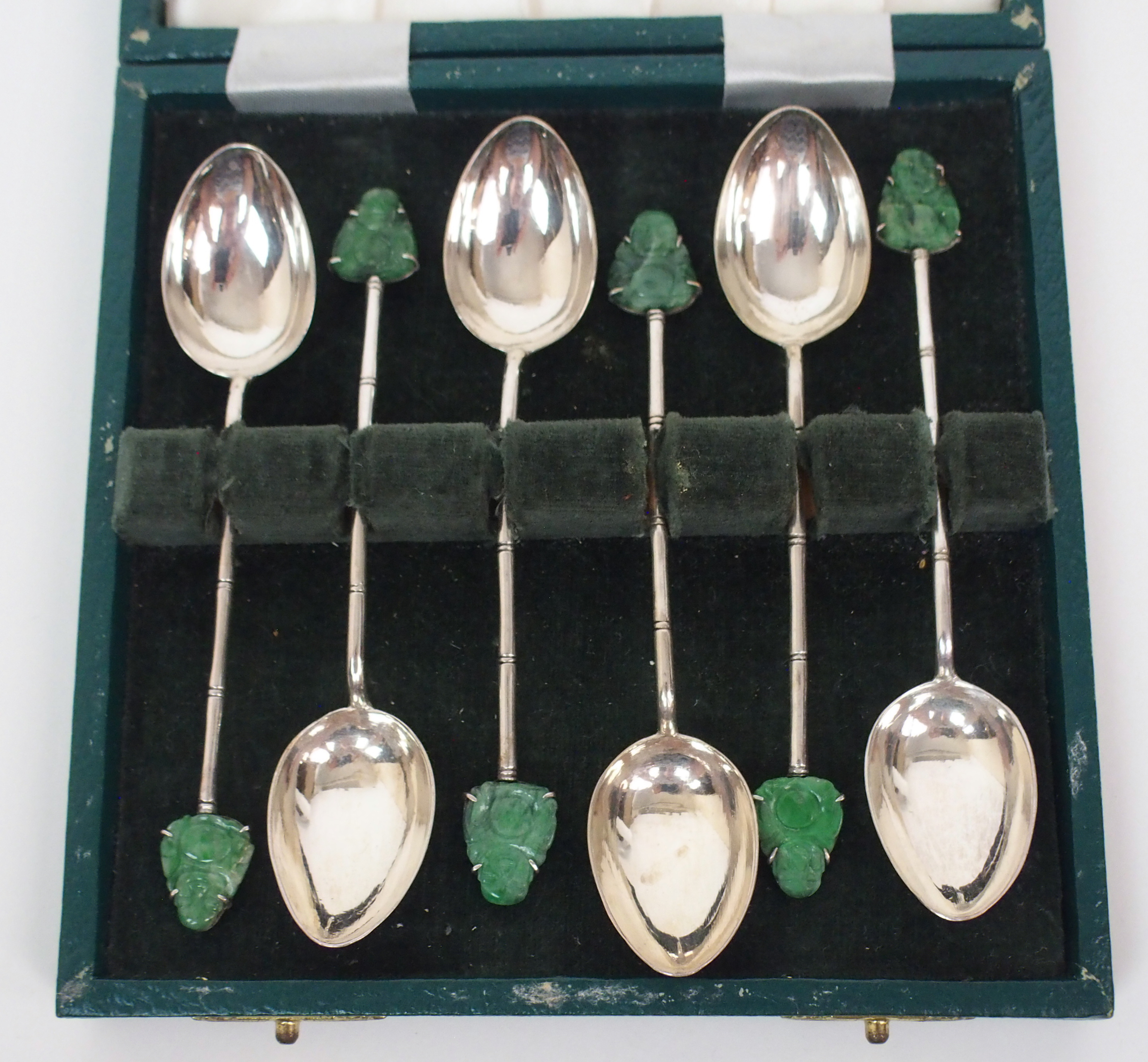 A SET OF SIX CHINESE SILVER TEASPOONS each set with a hardstone carving of Buddha, stamped Tack