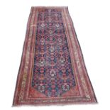 A HAMADAN BLUE GROUND RUNNER with allover design and multiple borders, 393cm x 134cm Condition