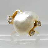 AN 18CT GOLD BAROQUE PEARL AND DIAMOND RING the cloud shaped pearl is approx 15.5mm x 12mm, enhanced