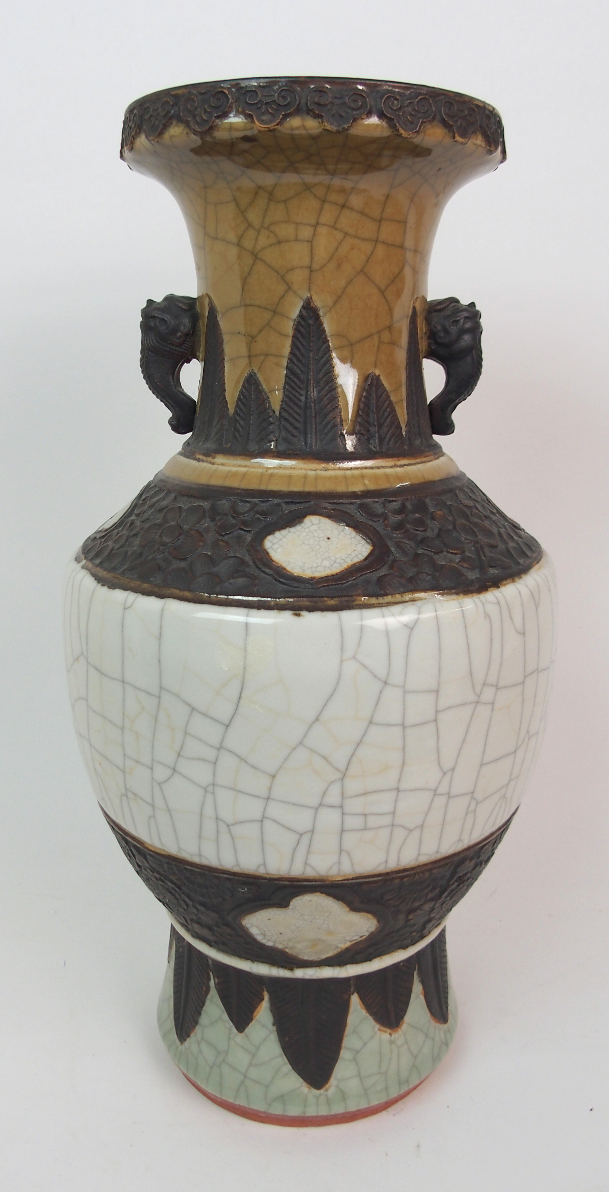 A CHINESE CRACKLEWARE THREE COLOUR VASE with grotesque handles and bands of foliage within stiff