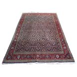 A HAMADAN BLUE GROUND RUG with allover design with red border, 188cm x 272cm Condition Report:
