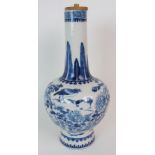 A CHINESE BLUE AND WHITE BALUSTER VASE painted with birds and butterflies amongst peonies beneath