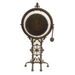 A VICTORIAN CAST IRON GONG AND STAND with stylised foliage and cross medallion above six curved