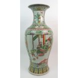 A CHINESE FAMILLE VERTE LARGE BALUSTER VASE painted with panels of figures surrounded by flowers and