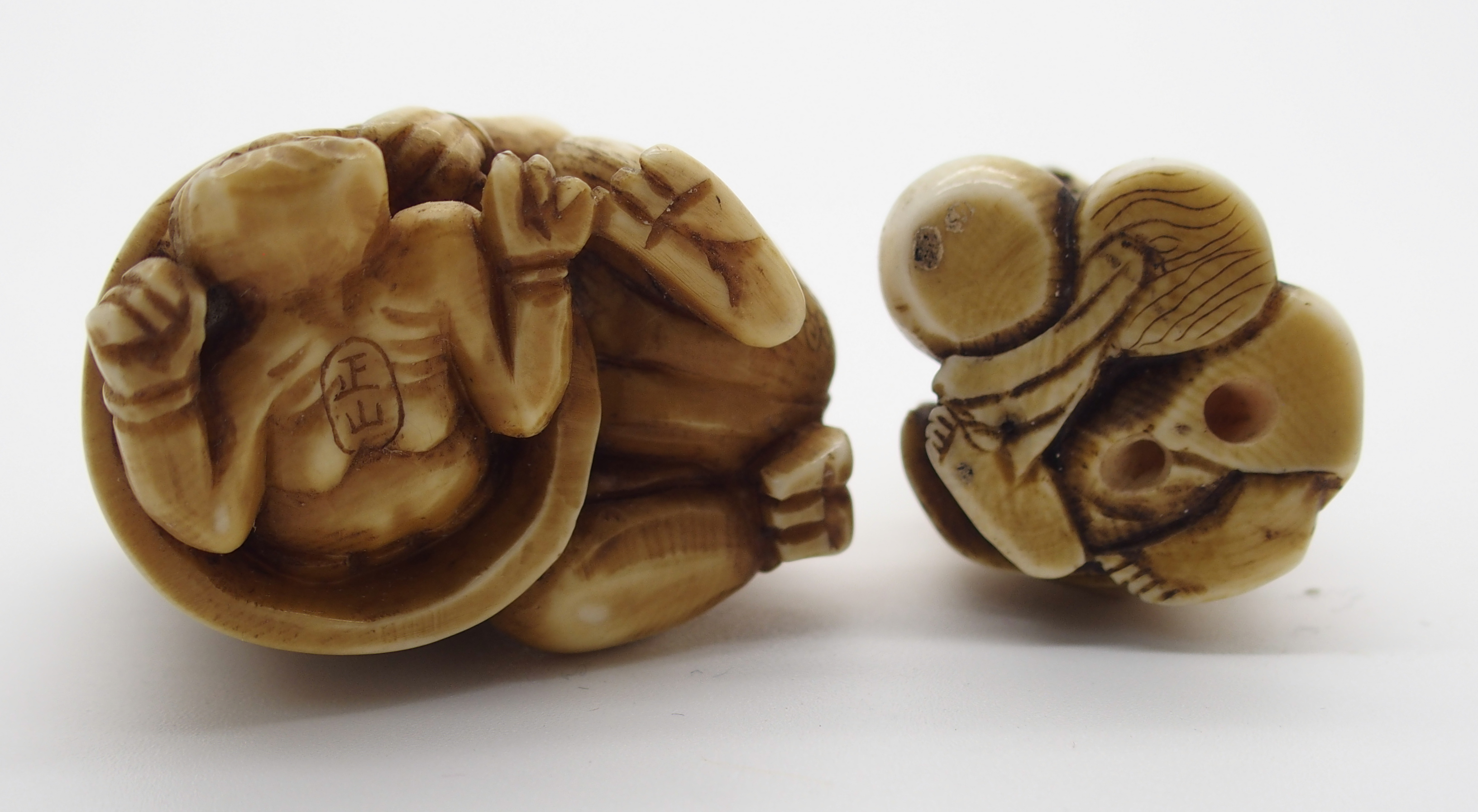 A JAPANESE IVORY OKIMONO ONI holding a temple bell enclosing another demon, 5cm high, a netsuke of a - Image 4 of 10